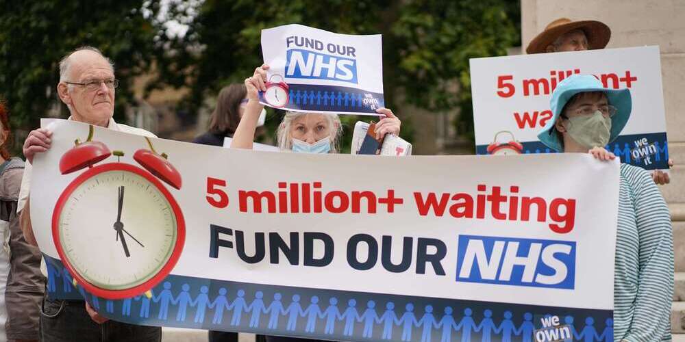 UK citizens protesting cuts in NHS budget