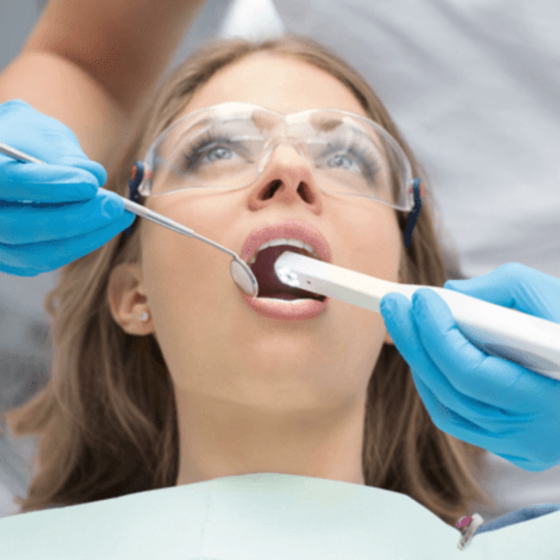 Women getting examined before having dental implants