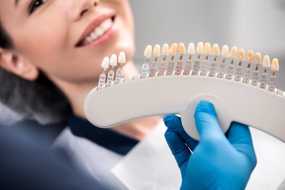 Patient choosing her new teeth in laminate veneer.
